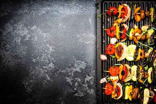 Grilled Vegetable Skewers with Herbs and Spices. Top View. border Background with Copy Space