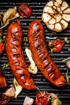 Grilled Sausages with Fresh Herbs and Spices. Close Up View on Grill. Summer Party Food.