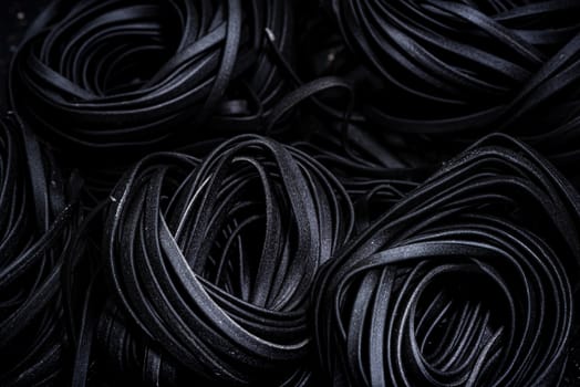 Squid Ink Black Pasta Spaghetti. Close Up View. Food Background.