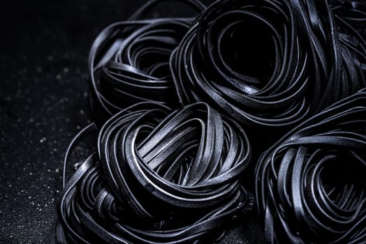 Squid Ink Black Pasta Spaghetti. Close Up View. Food Background.