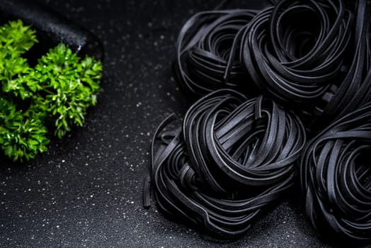 Squid Ink Black Pasta Noodles. Close Up View. Food Background.