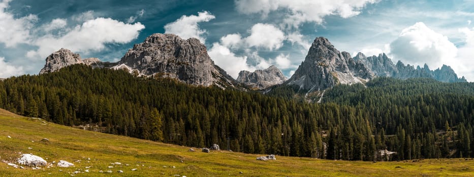 Tre Cimes di Lavaredo. Outdoor Adventure Wide Stitched Panorama. Panoramic Image of Italian Alps.