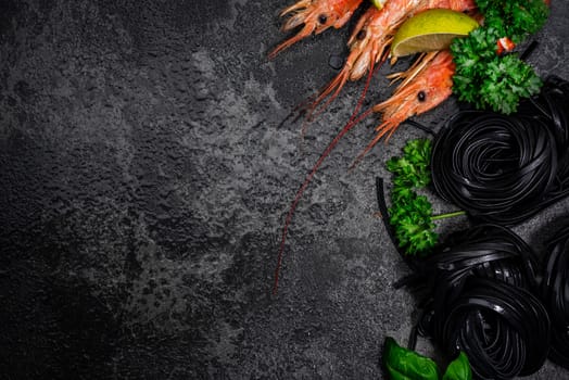 Squid Ink Black Pasta Spaghetti with Seafood and Fresh Herbs. Border Background with Copy Space. Top View.