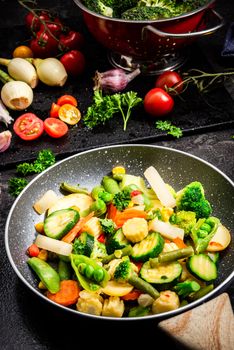 Stir Fry Vegetables on Pan. Healthy Eating and Dieting at Home. Dark Tones Image. Top Down View.