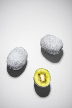 Modern Food Design. Monochrome Painted Kiwi Fruit Whole and Cut. Abstract Food Background.