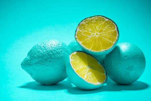 Modern Abstract Food Background. Blue Pastel Lemon Fruits on Vibrant Background.