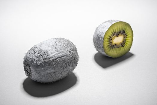 Modern Food Design. Monochrome Painted Kiwi Fruit Whole and Cut. Abstract Food Background.