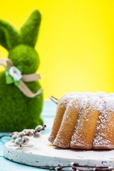 Easter Holiday Food on Table. Grass Bunny and Festive Cake.Copy Space Background.