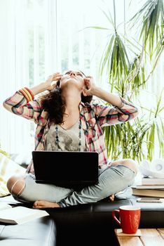 Young Woman Working From Home at Her Laptop in Coronavirus Pandemic Self Isolation.