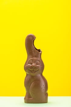 Funny Chocolate Easter Bunny. Easter Background with Copy Space. Festive Card Minimal Design Template.