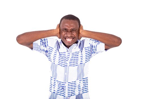 young man in shirt laughing covering his ears, isolated on white background.