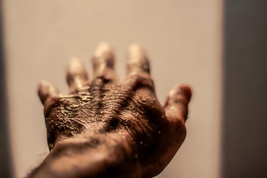 Photograph of an open wet human hand