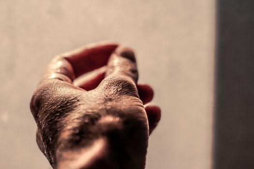 Photograph of a human wet hand