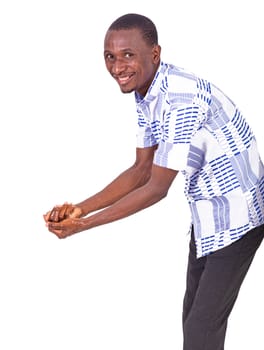 young man washing his hands thoroughly with antibacterial gel while smiling at the camera.