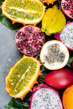 Tropical and Exotic Fruits Border Background. Fresh Raw Fruits on Concrete Background.