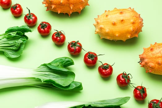 Fruits and Vegetables Patter. Flat Lay on Green Background. Raw Food Geometric Background.