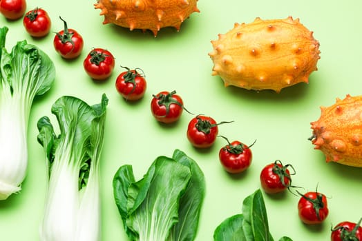 Fruits and Vegetables Patter. Flat Lay on Green Background. Raw Food Geometric Background.