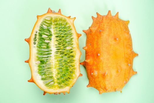 Kiwano or Horned Melon Fruit Cut in Half. Exotic Fruit. Detail Close Up. Pastel Background.