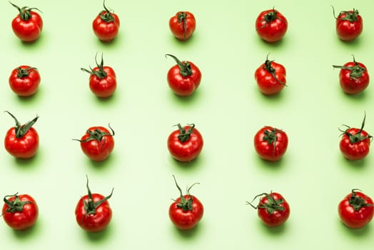 Vibrant Red Tomatoes on Green Background, Flat Lay Vegetable Pattern. Top View.