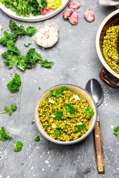 Healthy Eating. Vegetarian Brunch. Green Kale, Garlic and Groats in Bowl.
