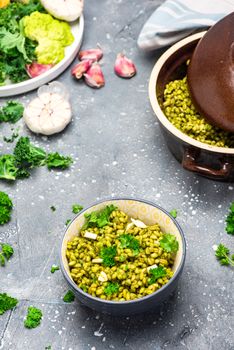 Cooking Vegetarian Plant Based Food. Buckwheat Groats with Kale, Garlic and Parsley.