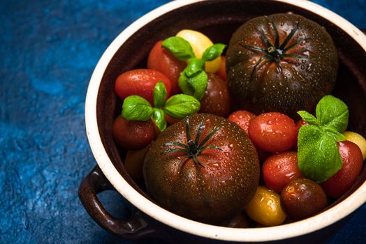 Organic Fresh Tomatoes in Ceramic Pan. Food Background.