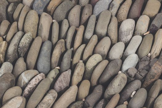 Photograph of a rounded river rocks background