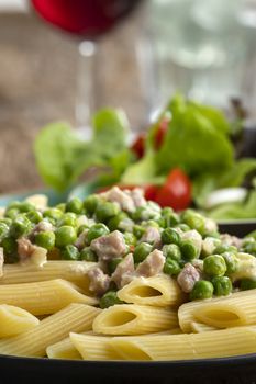 rigatoni emiliana on dark rustic wood