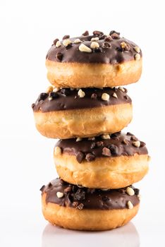 Chocolate and Peanuts Donut or Dougnut Tower on White Background.