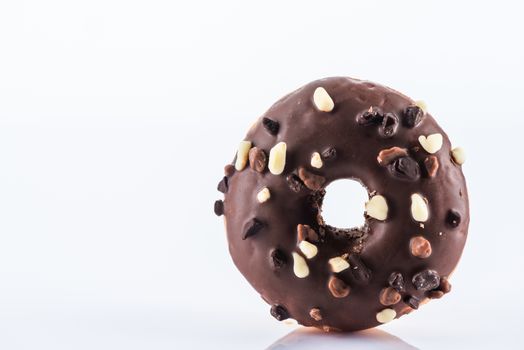 Single Chocolate Donut or Doughnut. Studio Photo on White Background, Cle Up view.