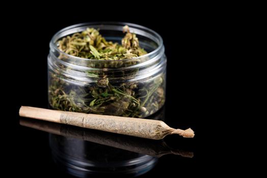 Recreational Prescription Medical Marijuana Joint and Cannabis Flower Buds in Jar.