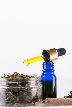 Droplet with CBD Cannabidiol Oil. Medical Marijuana and Cannabis Use Concept.