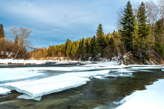 Ice over River San in Bieszczady Mountains at Winter Season.