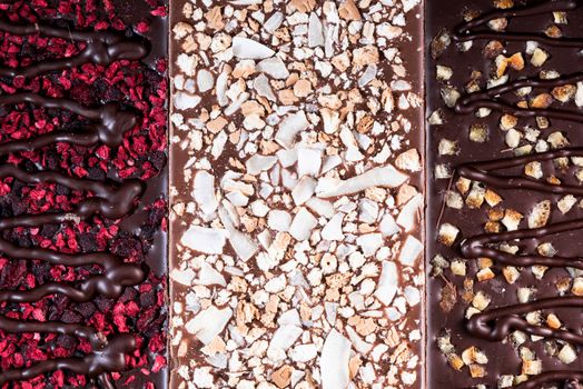 Chocolate Bars Topped with Freeze - Dried Fruits. Top Down Closeup View.