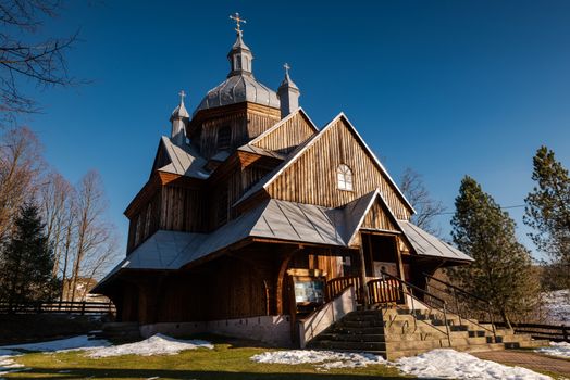 Exterior of Hoszow Wooden Orthodox Church.  Bieszczady Architecture in Winter. Carpathia Region in Poland.