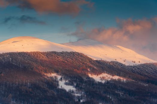 Sunrise over Polonyna Wetlinska and Carynska in Carpathian Mountains. Bieszczady, Poland at Winter Season.