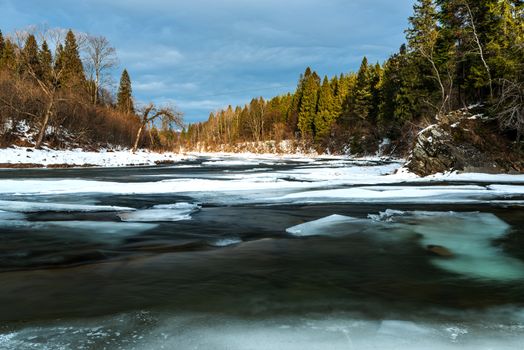 Ice over River San in Bieszczady Mountains at Winter Season.