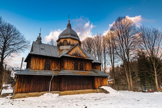 Exterior of St. Nicholas Orthodox Church in Chmiel.  Bieszczady Architecture in Winter. Carpathia Region in Poland.