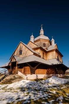 Wooden Orthodox Church in Hoszow. Carpathian Mountains and Bieszczady Architecture in Winter.