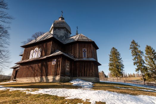 Wooden Orthodox Church in Hoszowczyk. Carpathian Mountains and Bieszczady Architecture in Winter.