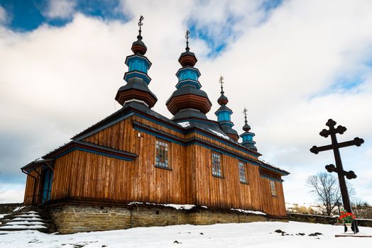 Exterior of Komancza Wooden Orthodox Church.  Bieszczady Architecture in Winter. Carpathia Region in Poland.
