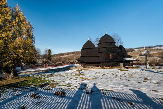Exterior of Rownia Wooden Orthodox Church.  Bieszczady Architecture in Winter. Carpathia Region in Poland.