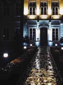 Exterior facade of classic building in the European city at night, architecture and design detail