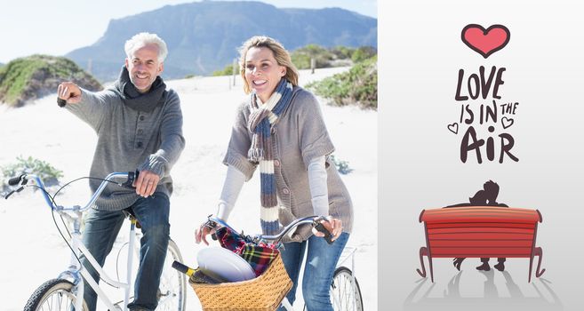 Carefree couple going on a bike ride and picnic on the beach  against love is in the air