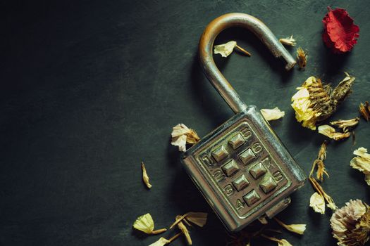 Combination padlock on blackboard background. Top view and copy space. Concept of safety and secret in vintage style.