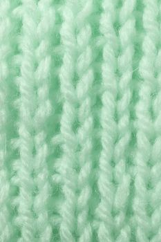 Light Green Wool Knitting Texture. Vertical Across Weaving Crochet Detailed Rows. Sweater Textile Background. Macro Closeup.