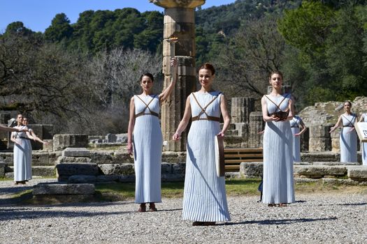 Olympia, Greece -  March 12, 2020: Olympic Flame handover ceremony for the Tokyo 2020 Summer Olympic Games at the Ancient Olympia site, birthplace of the ancient Olympics in southern Greece.