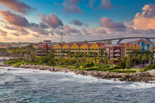 Brightly colored resort hotels on the coast of Curacao