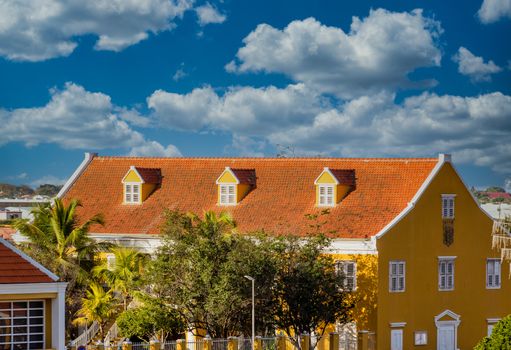 Red Tile Roof on Bonaire Government Building under blue sky