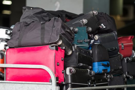 Thessaloniki, Greece - June 18, 2015: luggage cart on the runway of the airport Macedonia a rainy day 